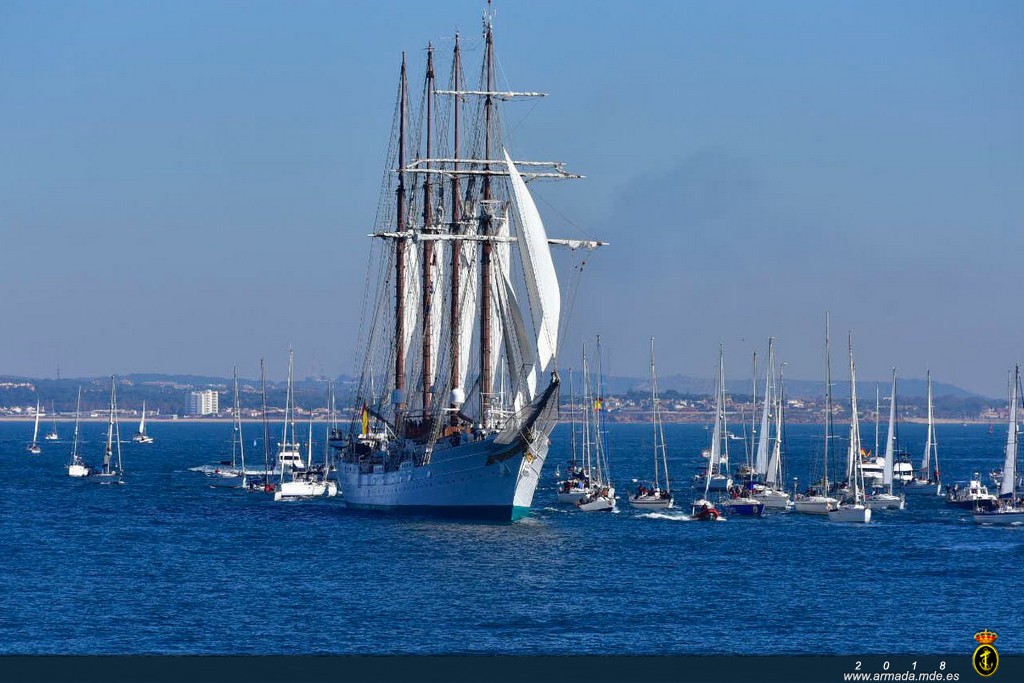 ‘Juan Sebastián de Elcano’ leaving port accompanied by other ships